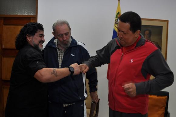 Maradona with Hugo Chavez and Fidel Castro.