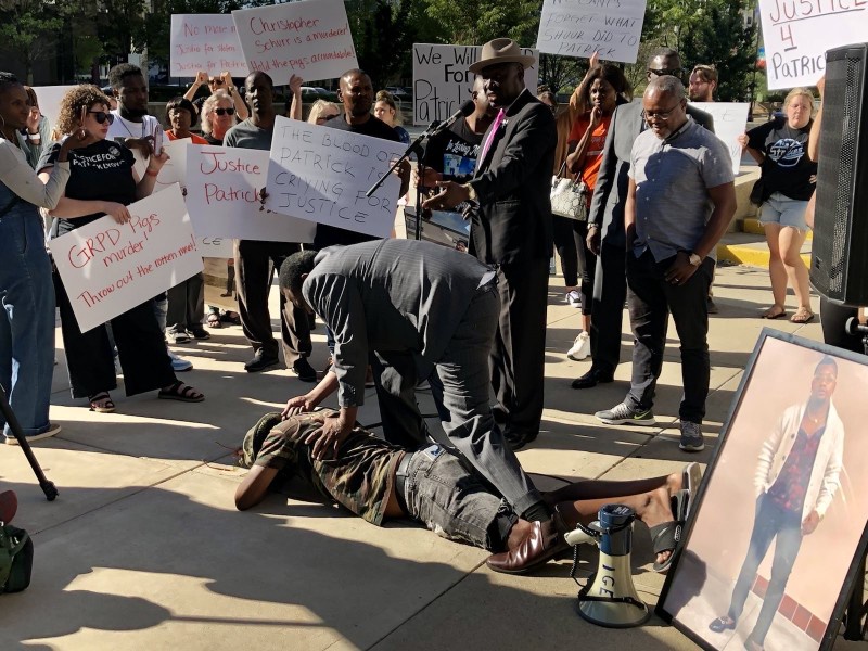 Robert Womack and Reginald James demonstrate how Patrick Lyoya was murdered in A