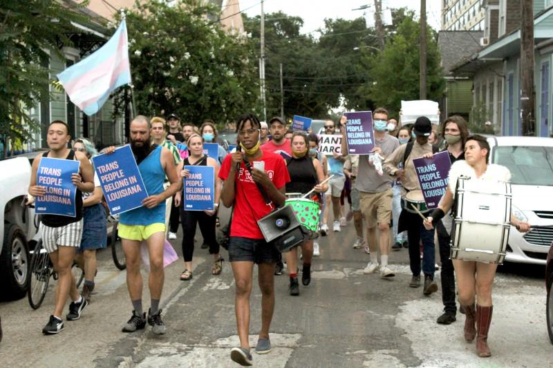 Protesters take to the streets to oppose the trans sports ban.