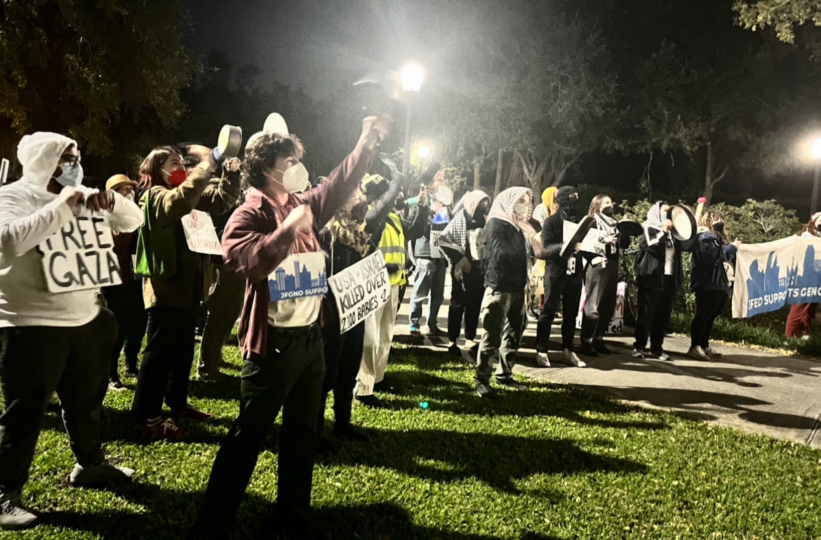 Pro Palestine protesters gather around the Audubon Tea Room with noise-making equipment