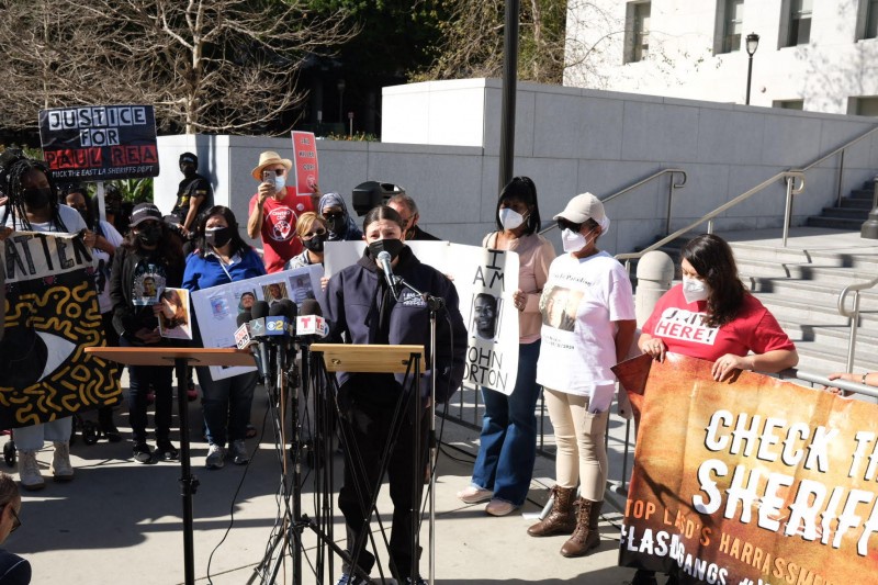 Stephanie Luna speaking at Check the Sheriffs press event calling for stronger c