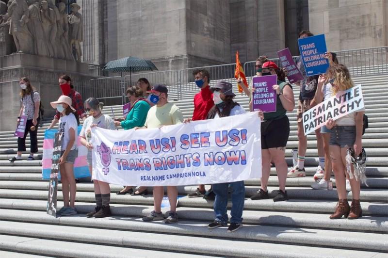 TGNC people and allies rally at the state capitol’s front steps.