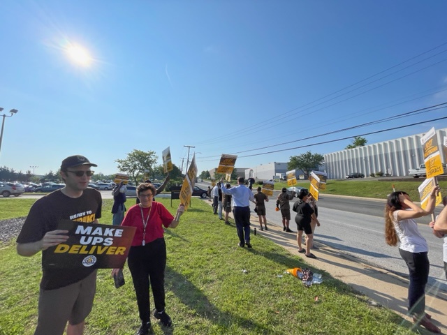 Zach Callahan (left) of Teamster Local 639 at UPS picket, Landover, Maryland.