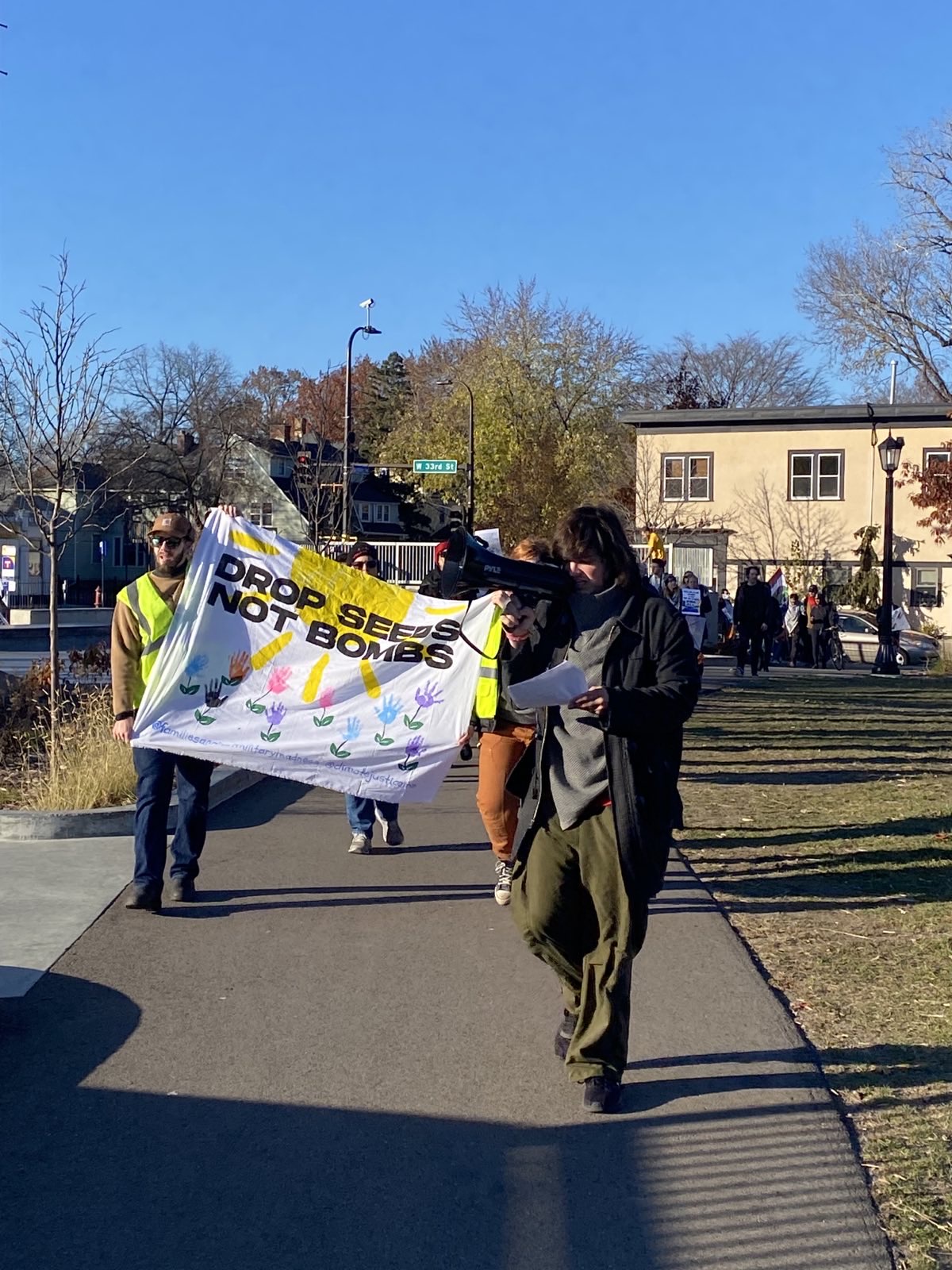Community members march through Painter Park in Uptown Minneapolis.  | Staff/Fight Back! News