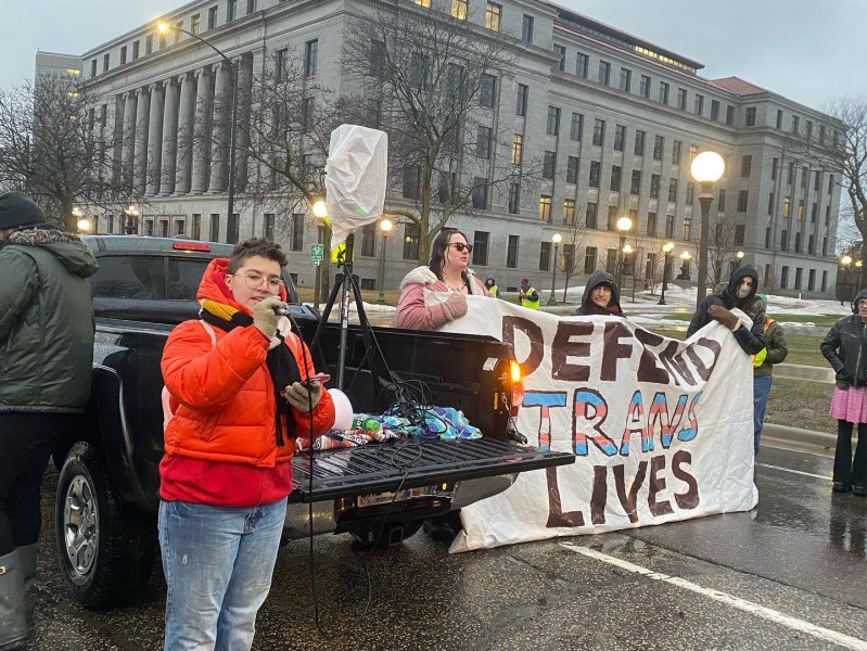Robyn Harbison speaking to the crowd on the march route.
