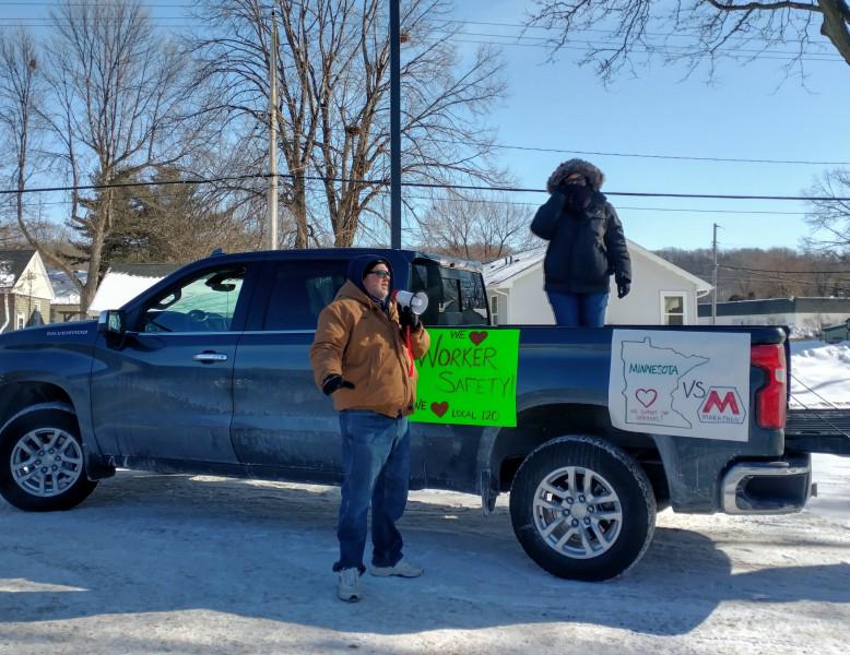 Locked out Marathon worker speaks at rally before start of  car caravan.