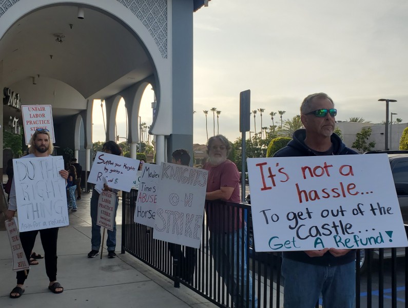 Striking workers at Medieval Times Dinner and Tournament on the picket line.