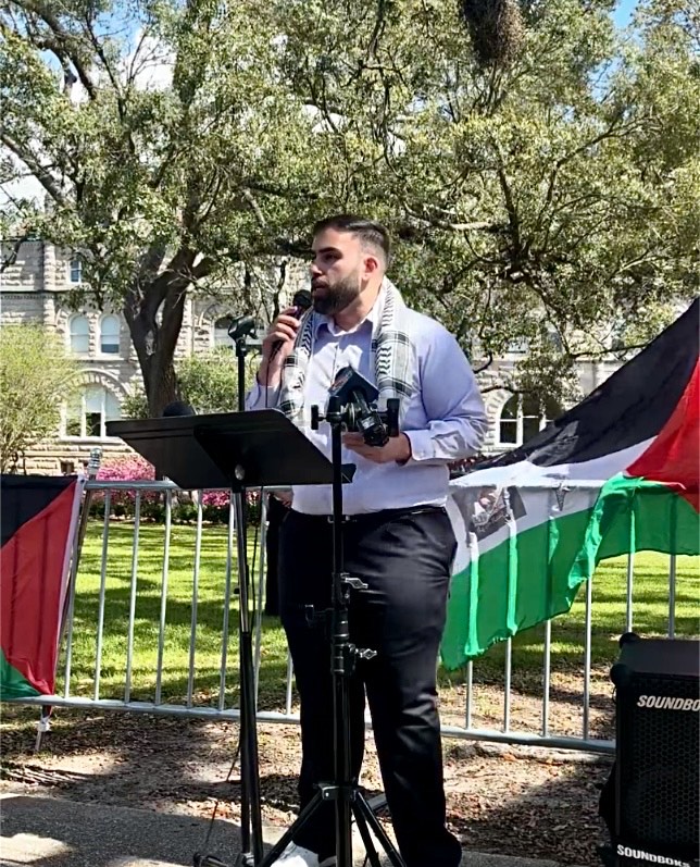 Hakm Murad, an activist from Palestinian Youth Movement New Orleans, speaks to the press in front of Tulane University’s barricaded lawn.