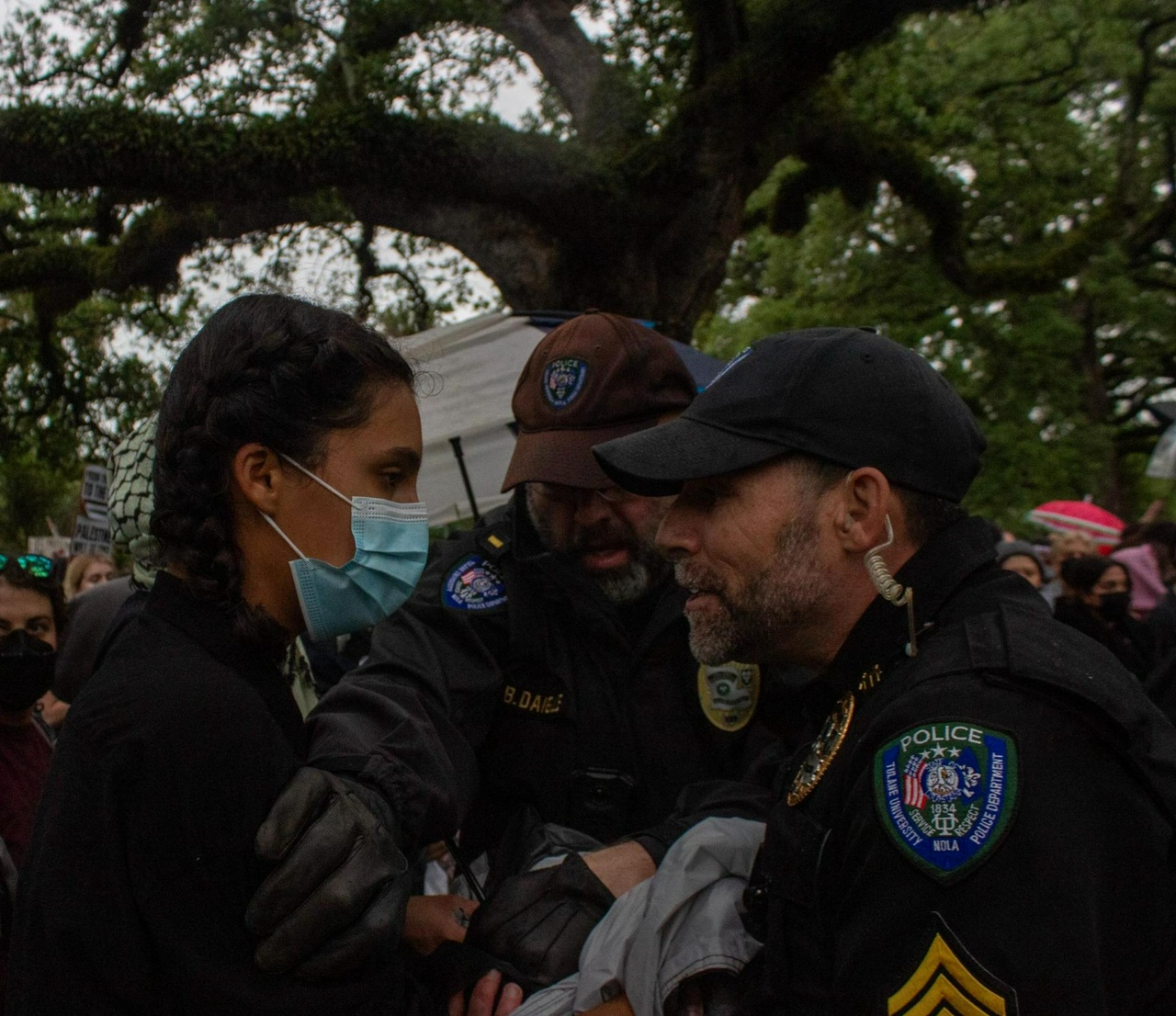 A police officer arresting a protester. 