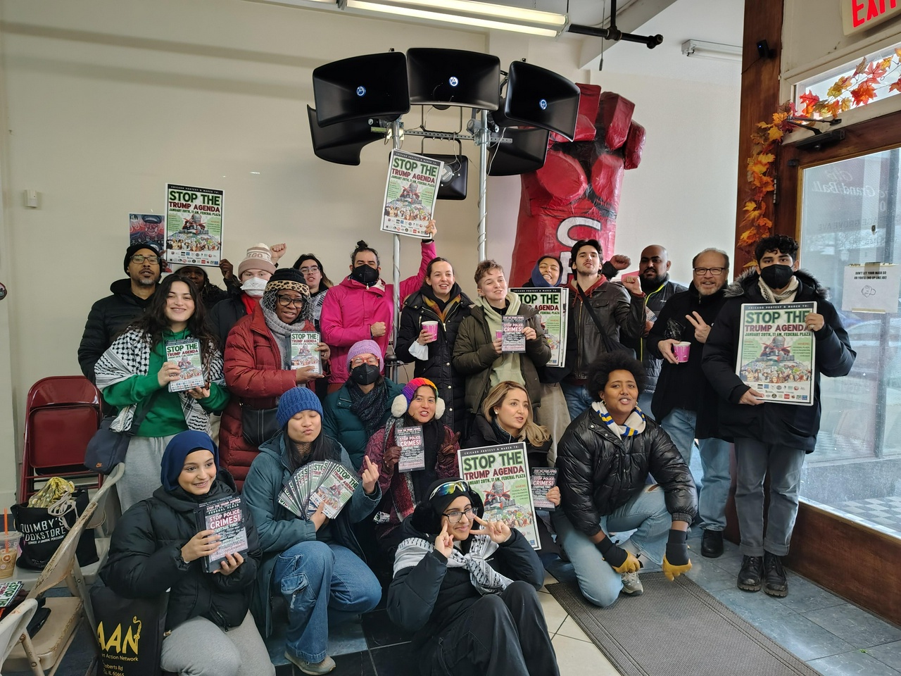 Canvassers preparing to spread the word about the January 20 demonstration chant “F Trump” before heading out to flyer the community.