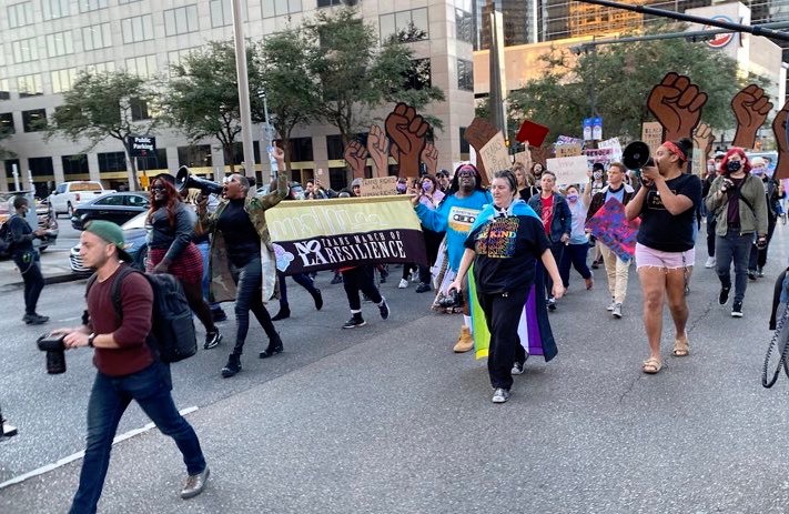 Participants in Trans March of Resilience march through downtown New Orleans.