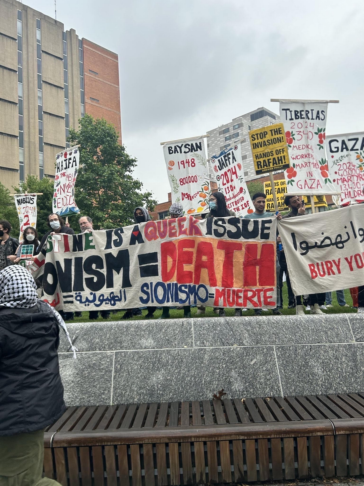 Philadelphia pro-Palestine marchers surround the quad with banners and signs, shielding the encampment. | Photo: Amber Kahn