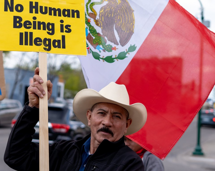 Minneapolis protest demands immigrant rights.