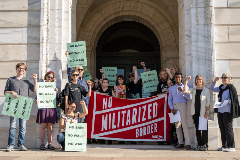 Protest demands Minnesota divest from border militarization contractor.