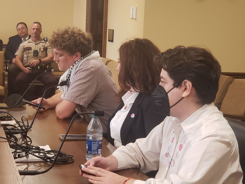 Wyatt Miller speaking to the MN State Board of Investment seated next to Elizabe