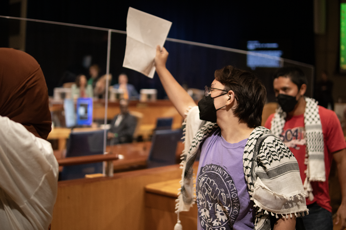 Pro-Palestine protesters walking out of city council chambers in New Orleans.  | Staff/Fight Back! News